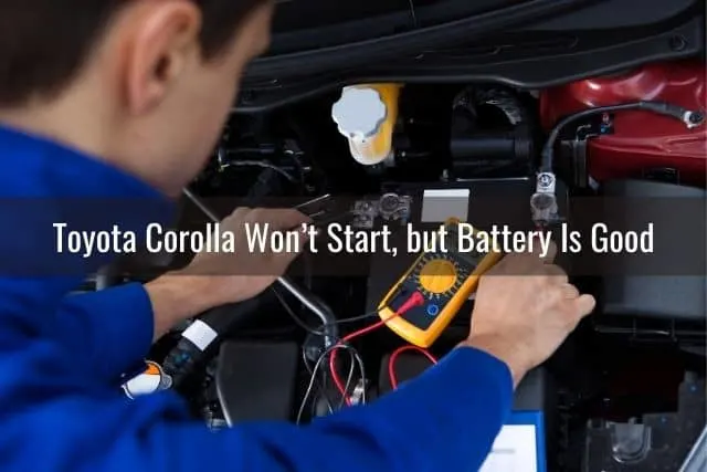 A man testing the car battery with a multimeter