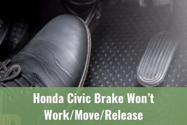 A foot stepping on the car brake pedal