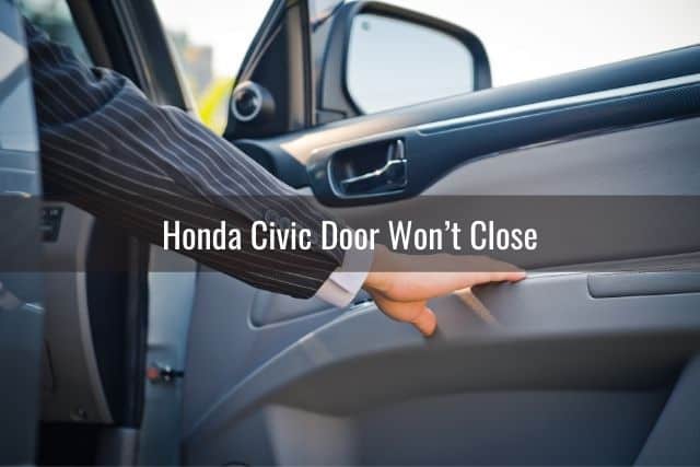 Hand pulling car door closed