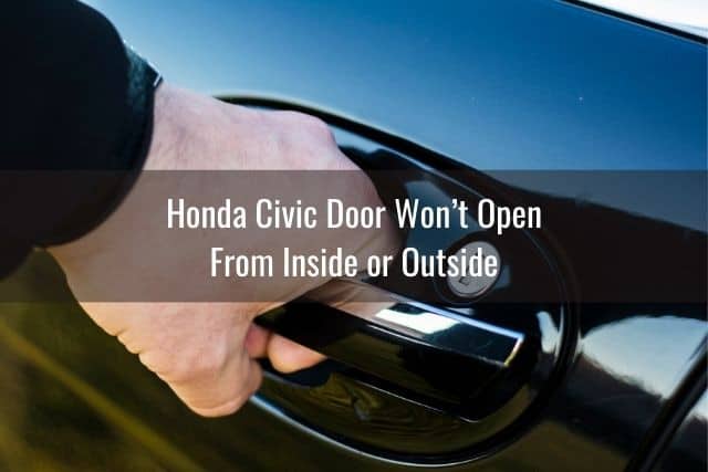 Hand pulling car door handle from the outside