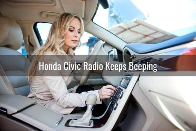 Woman adjusting the car radio