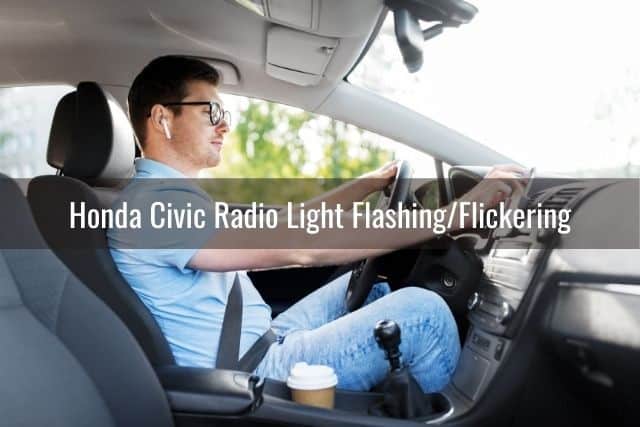 Guy with glasses driving and adjusting car radio