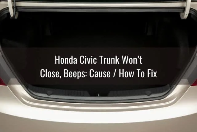 Inside of gold Honda Civic trunk