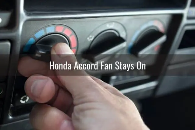 Hand turning car AC control knob