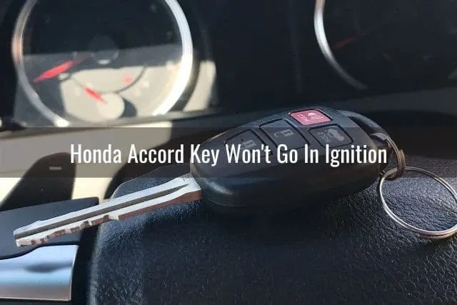Car key in front of steering wheel