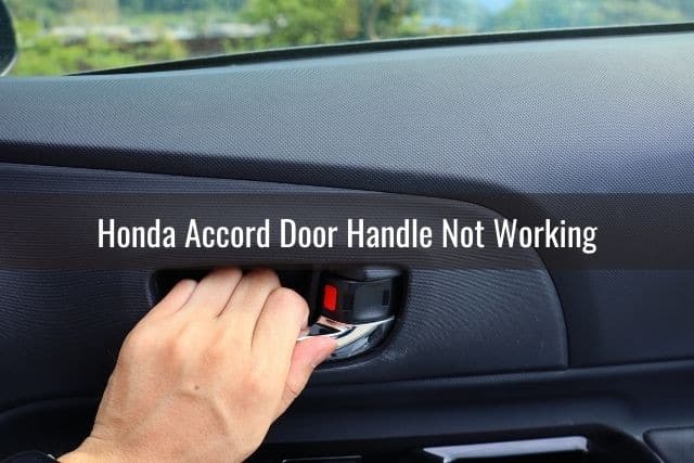 Hand pulling on inside car door handle