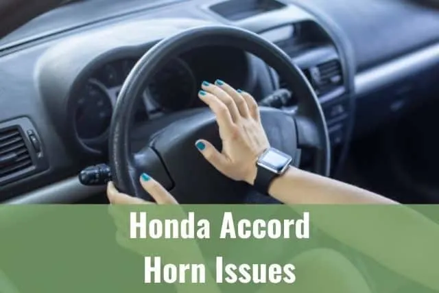 Hand pressing car horn