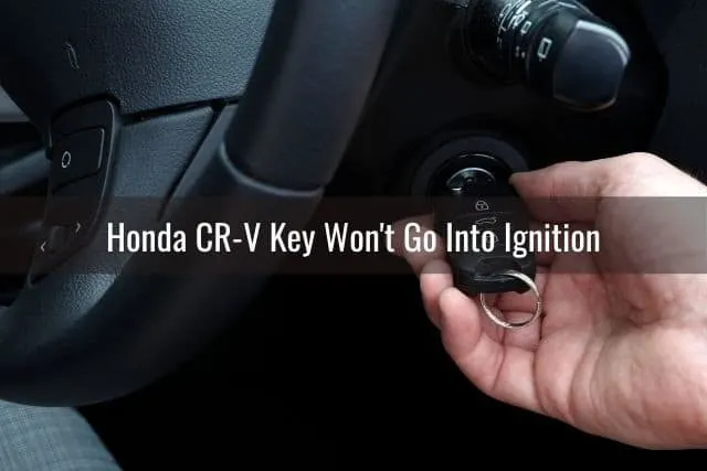 Putting car key into ignition