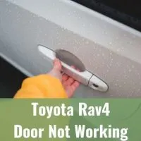 Hand opening white car door handle