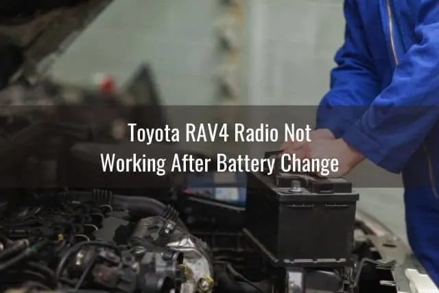 Mechanic replacing car battery