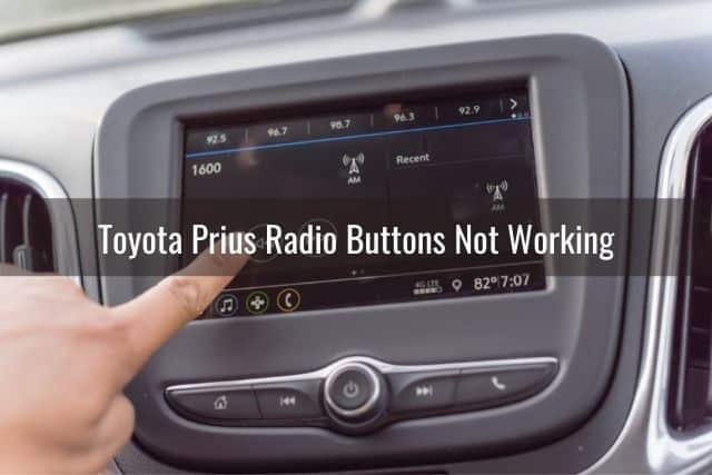 Finger pressing car radio touch screen buttons
