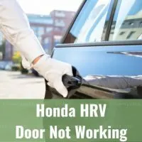 Hand pulling car door handle