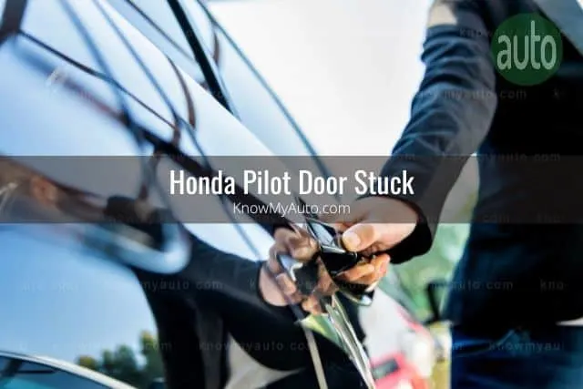 Hand pulling on car door handle