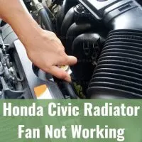 Hand touching car radiator cap