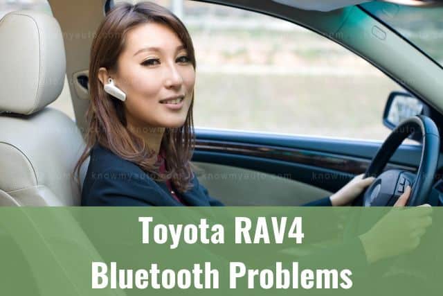 Female driving while wearing bluetooth earpiece