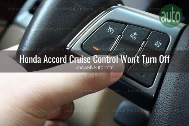 Hand on car steering wheel using cruise control