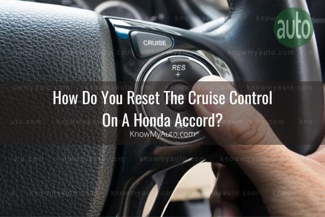 Hand on car steering wheel using cruise control