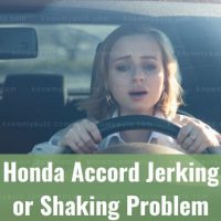 Nervous female car driver with both hands on steering wheel