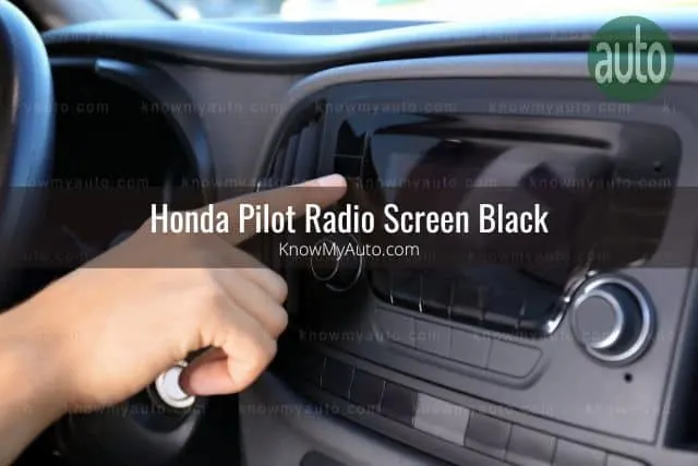 Person pressing car touchscreen