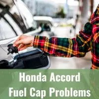 Hand taking off car gas cap