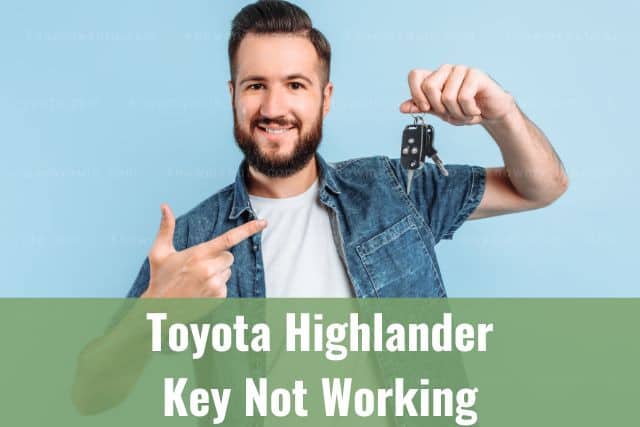 Guy holding car keys in one hand and pointing to it with the other hand