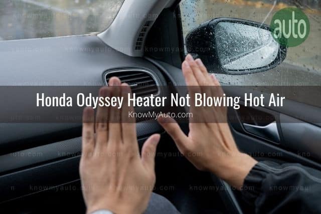 Hands feeling car vents blowing air