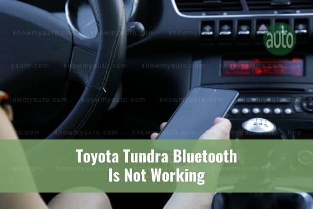 Person connecting phone to car Bluetooth