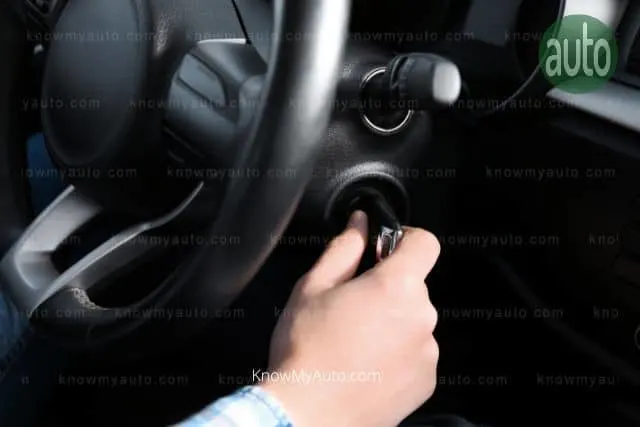 Hand putting key in ignition