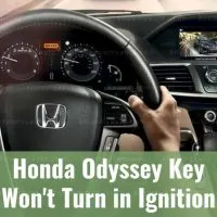 Two hands on Honda Odyssey steering wheel