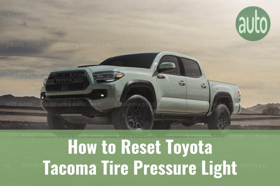 White Toyota Tacoma truck climbing hill