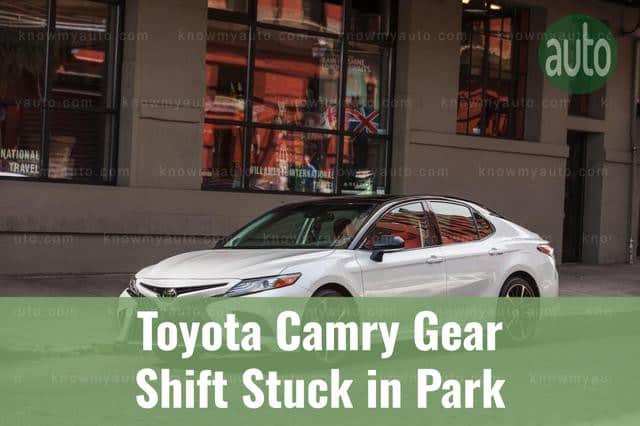 White Toyota Camry Parked in Front of City Building